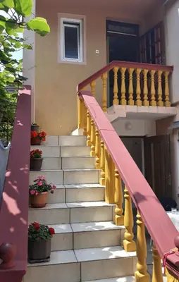 a set of stairs in front of a house at Apartman Tatjana in Sutomore
