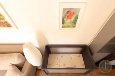 a box in the corner of a room with a painting at Ancora 3 in Budva