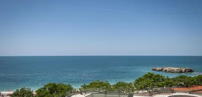 a view of the ocean with rocks in the water at Queen Apartments & Rooms in Dobra Voda