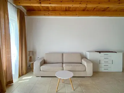 a living room with a couch and a table at Apartments Al Parma in Budva
