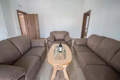 a living room with a couch and a coffee table at 3rooms,11 people in Bar