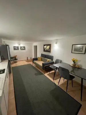 a living room with a couch and a table at Ori in Podgorica