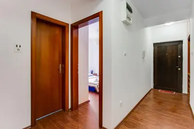 an empty room with two doors and a hallway at Apartment Lavender of Budva in Budva