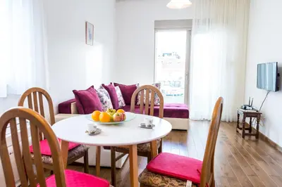 a living room with a table with fruit on it at Lagoon Apartments in Budva