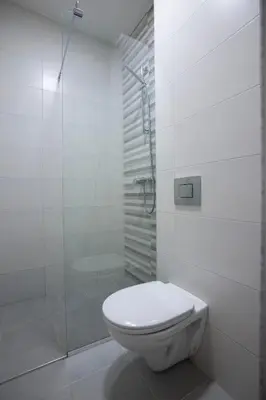 a bathroom with a toilet and a glass shower at Guest House Djonovic in Petrovac na Moru