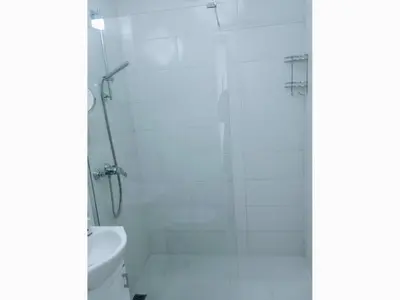 a bathroom with a shower and a toilet at Guest House Djonovic in Petrovac na Moru