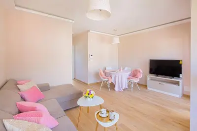 a living room with a couch and a table at Chiron Apartments in Budva