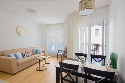 a living room with a couch and a table at Chiron Apartments in Budva