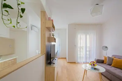 a living room with a couch and a table at Chiron Apartments in Budva