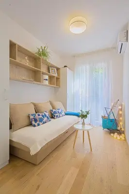 a living room with a couch and a table at Chiron Apartments in Budva