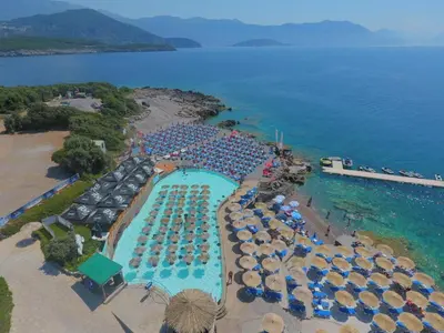 an aerial view of a resort with a pool and umbrellas at Lux Apartment MMS1 in Krimovice