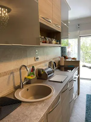 a kitchen with a sink and a counter top at Lux Apartment MMS1 in Krimovice