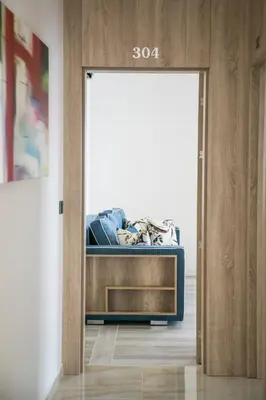 a door leading into a room with a bed at Villa Delux in Ulcinj