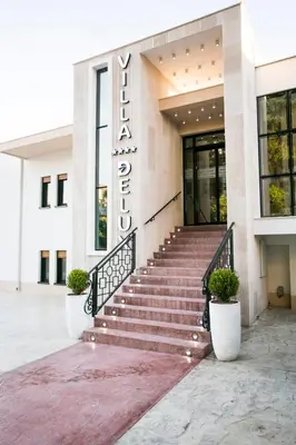 a building with a staircase in front of it at Villa Delux in Ulcinj