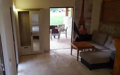 a living room with a couch and a table at Olive Paradise in Ulcinj
