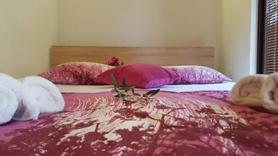 a bedroom with a bed with stuffed animals on it at Olive Paradise in Ulcinj