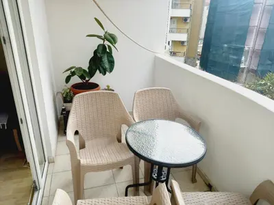 a small table and chairs on a balcony at B4 in Budva