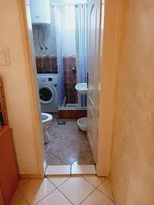 a bathroom with a toilet and a sink at B4 in Budva