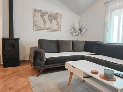a living room with a couch and a coffee table at Village experience - Skadar lake in Virpazar