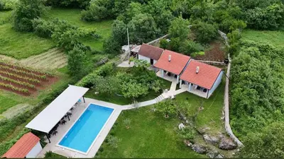 an aerial view of a house with a swimming pool at Rustic village in Rijeka Crnojevića