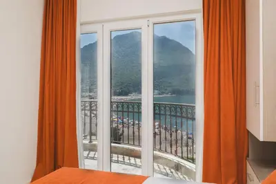 a room with a window with a view of a mountain at Villas Promis in Čanj