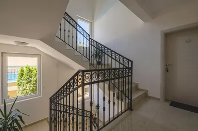 a staircase in a house with a window at Villas Promis in Čanj