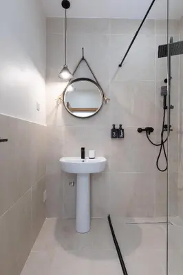 a bathroom with a sink and a shower with a mirror at VerDi in Kotor