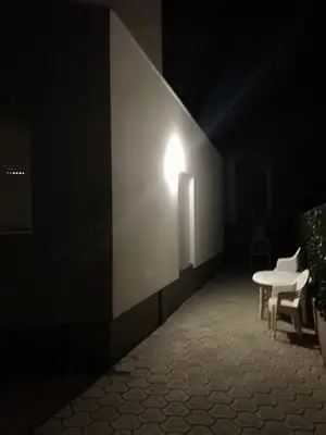 a room with white chairs and a light on a wall at Kevin-Talisa Villa in Bar