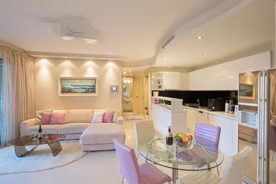 a living room with a couch and a table at Premier LUX apartment in Budva