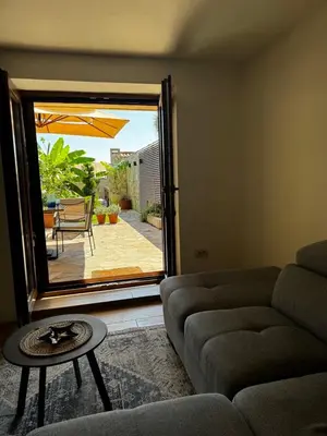 a living room with a couch and a table at Reina in Petrovac na Moru