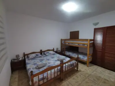 a bedroom with two beds and a bunk bed at Bar-Apartman 2 in Bar