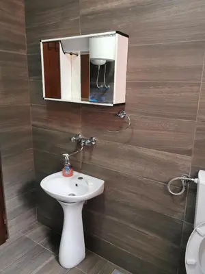 a bathroom with a sink and a mirror at Bar-Apartman 2 in Bar
