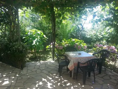 a table and chairs sitting on a patio at Bar-Apartman 2 in Bar