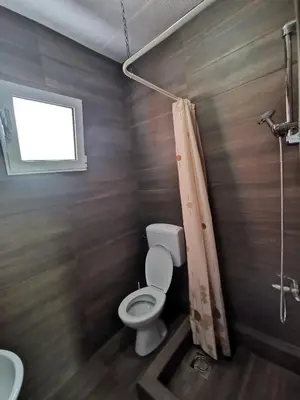 a bathroom with a toilet and a sink at Bar-Apartman 2 in Bar