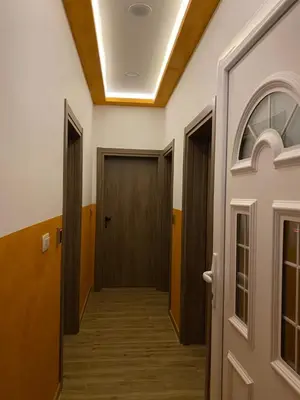 a hallway with two doors and a hallwayngth at Apart dom Janković in Sutomore