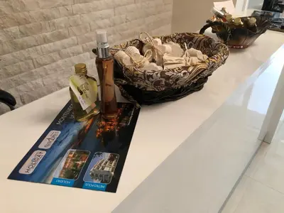 a table with a bottle of alcohol and a basket on it at 