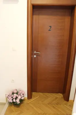 a wooden door with a number on it at Apartments Balabusic in Budva