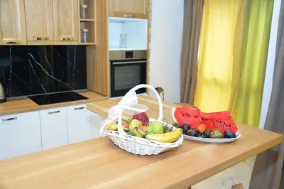a basket of fruit on a counter in a kitchen at Apartments Balabusic in Budva
