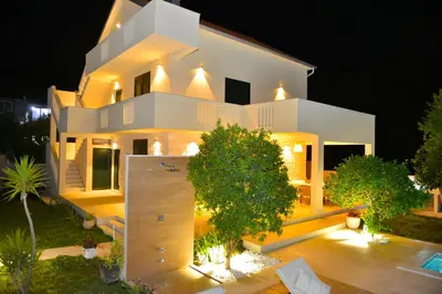 an aerial view of a white house at night at Villa Jovanovic in Tivat