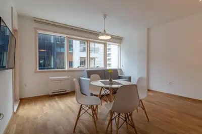 a dining room with a table and chairs at Lungomare Lux Apartments in Budva