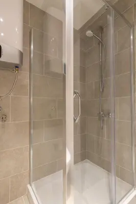 a shower with a glass door in a bathroom at Lungomare Lux Apartments in Budva