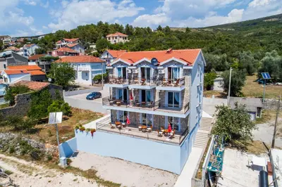 an aerial view of a house in a town at Villa SAN Apartments in Tivat