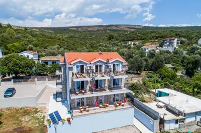 an aerial view of a building with a pool at Villa SAN Apartments in Tivat