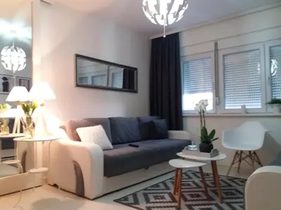 a living room with a couch and a table at Holiday Home Duka's in Bar