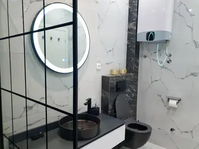 a bathroom with a sink and a mirror at Villa Preciosa in Kotor