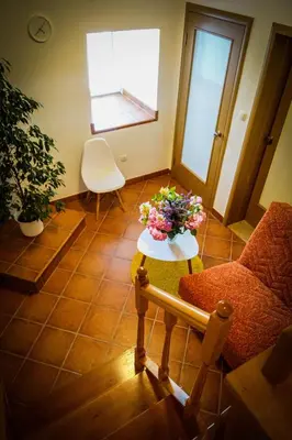 a living room with a table with flowers on it at Markov konak in Cetinje