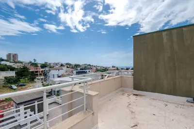 an apartment balcony with a view of a city at 1bd Modern Apt in Dobra Voda with Roof Access 