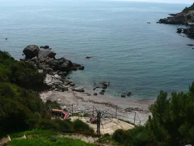 a view of a beach with rocks in the water at Apartmani Scepanovic in Sutomore
