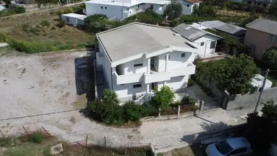 an aerial view of a white house at Apartmani Scepanovic in Sutomore