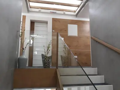 a stairway with two vases on the wall at Tilia in Cetinje